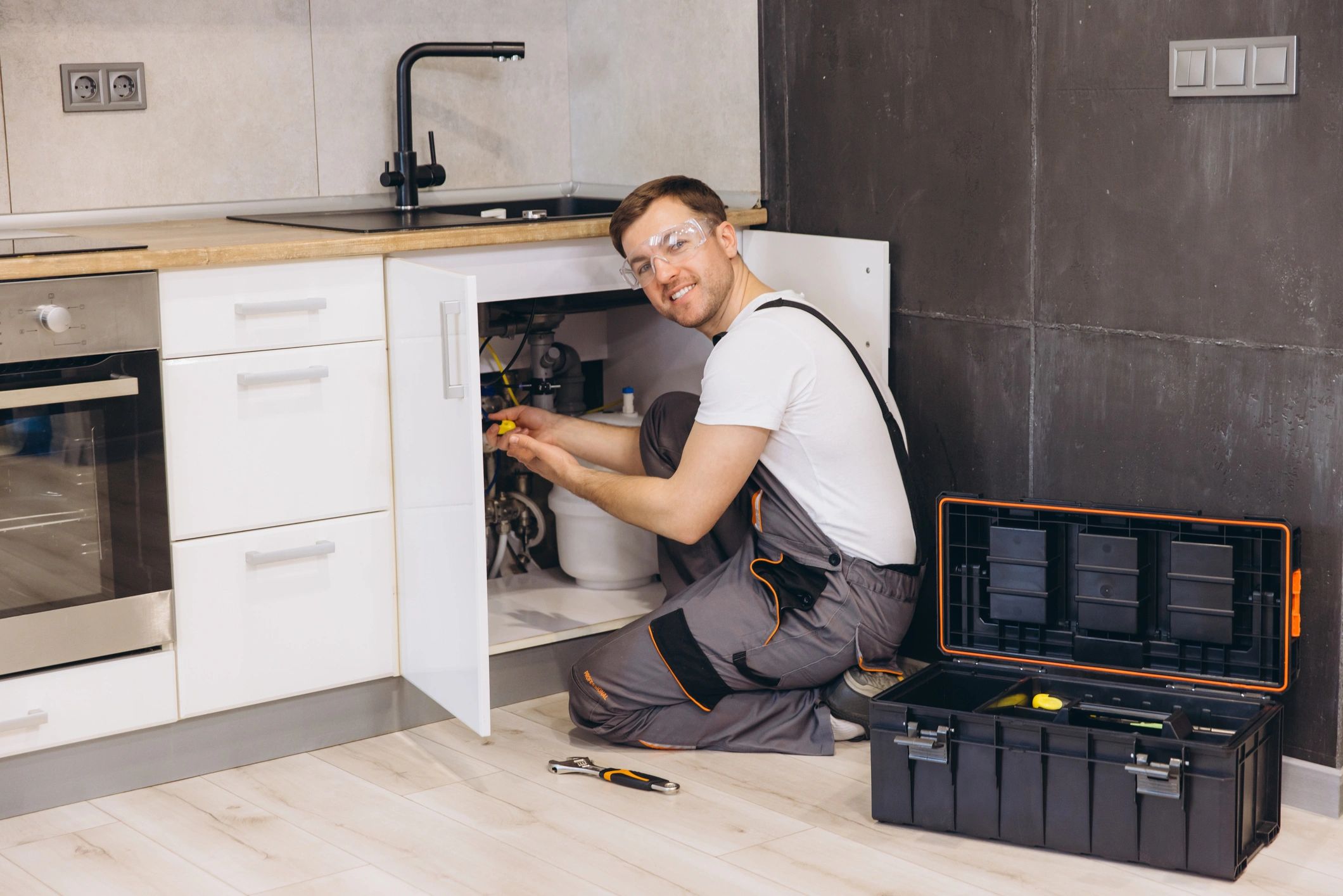 Plumber installing a water heater in a home